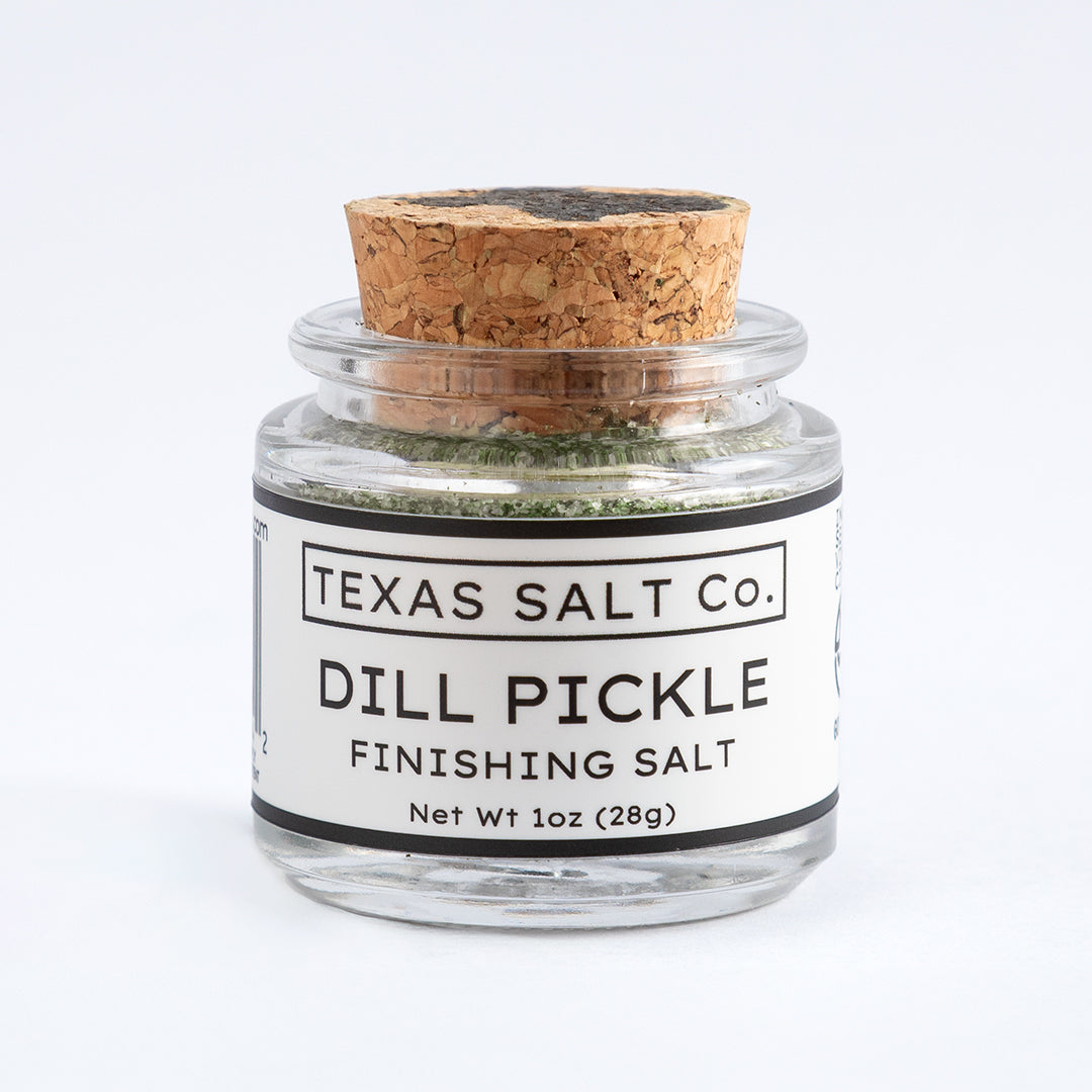 Small cork top jar of Dill Pickle Finishing Salt – 1oz by Texas Salt Co.