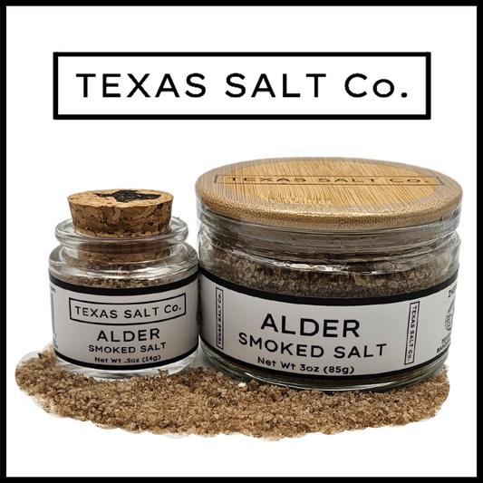 Texas Salt Co. Alder Smoked Salt – dual jars with cork-top and bamboo-lid styles, filled with light, clean alder wood–smoked sea salt ideal for fish, chicken, and delicate grilling recipes