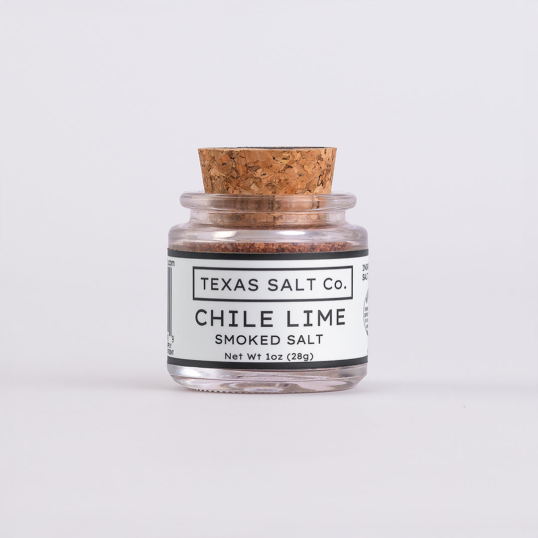 Mini glass jar of Texas Salt Co. Chile Lime Smoked Salt, 1 oz (28g), with cork lid and white label.