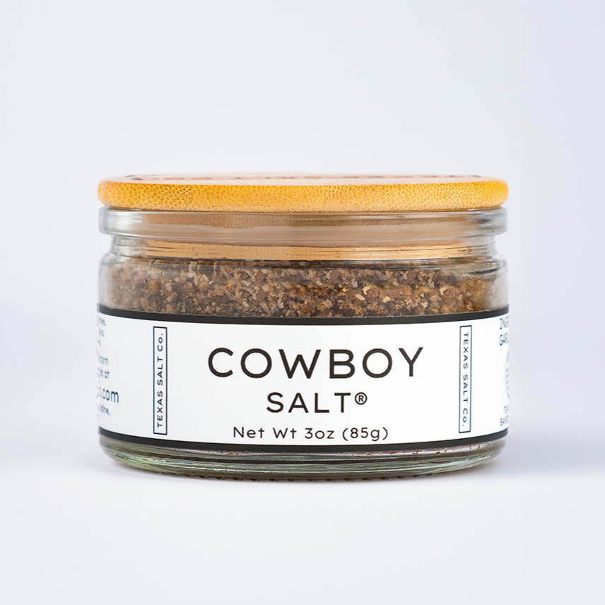 Straight-on view of Texas Salt Co.’s Cowboy Salt in a 3 oz jar with bamboo lid on white background.