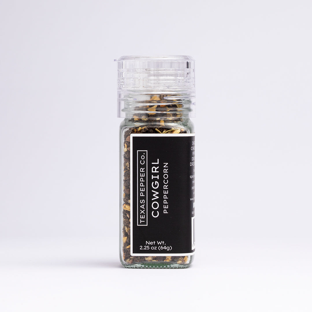 Texas Pepper Co. Cowgirl Peppercorn blend in a 2.25 oz (64g) glass grinder jar with black label and clear top.