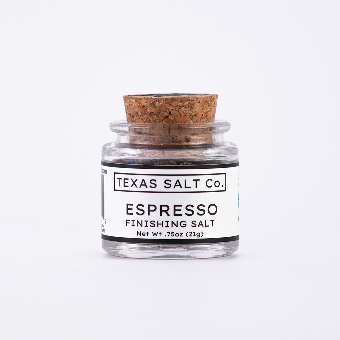 Mini glass jar of Texas Salt Co. Espresso Finishing Salt, 0.75 oz (21g), with cork lid and white label, filled with coffee-infused salt.