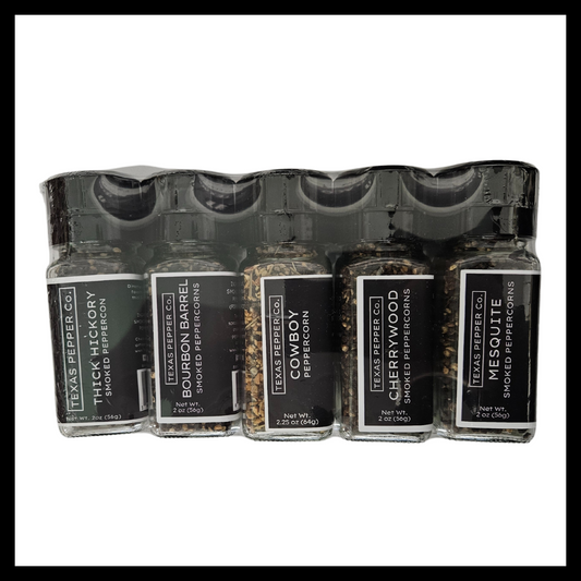 Texas Salt Co. Smoked Peppercorn Gift Set – five smoked peppercorn varieties in grinder-top jars: Thick Hickory, Bourbon Barrel, Cowboy, Cherrywood, and Mesquite