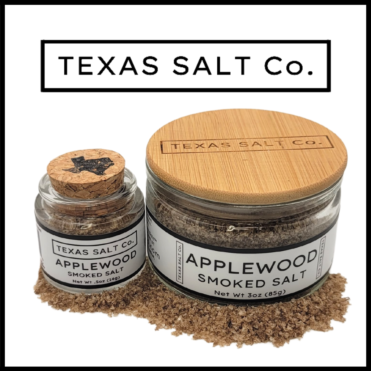 Texas Salt Co. Applewood Smoked Salt – dual glass jars with cork and bamboo lids, filled with light brown applewood-smoked sea salt ideal for grilling pork, poultry, or roasted veggies
