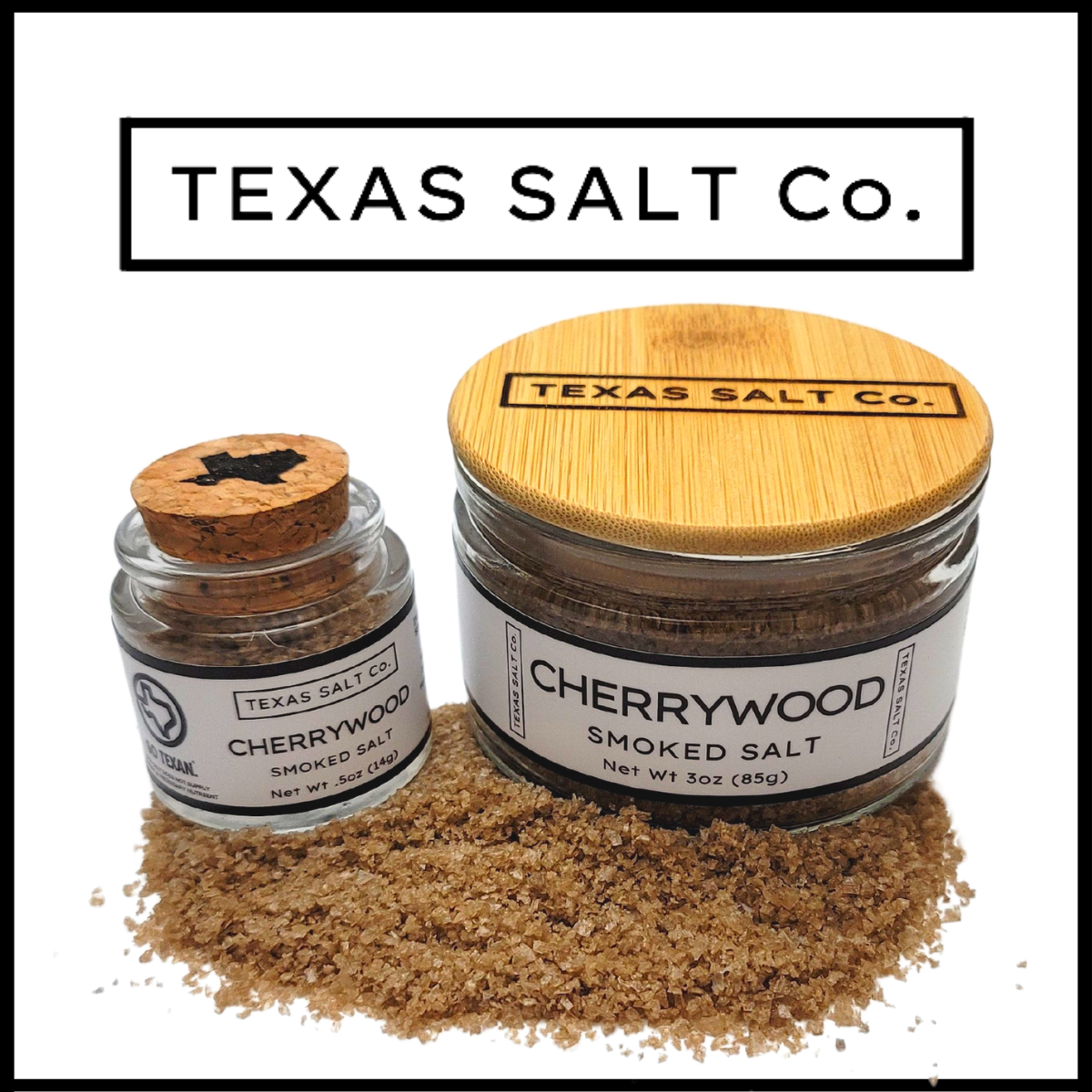 Texas Salt Co. Cherrywood Smoked Salt – cork-top and bamboo-lid jars filled with cherrywood-smoked sea salt, offering a mild, sweet smoke flavor ideal for pork, chicken, and everyday cooking