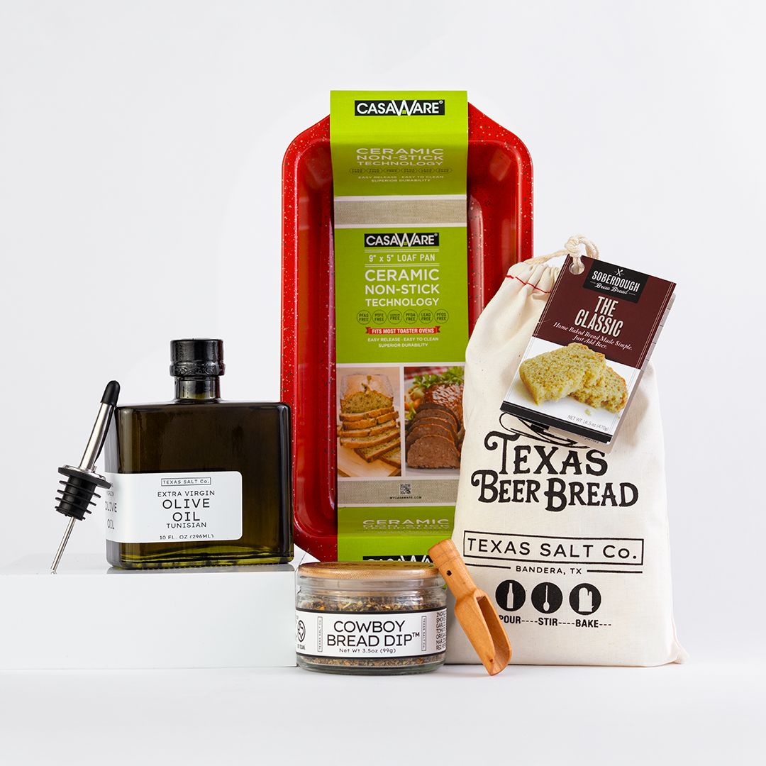 Collection of kitchen items including a bottle, tray, and bags on a white background