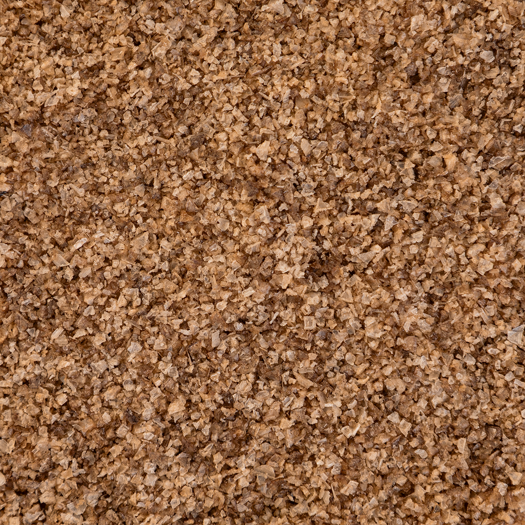 Close-up texture shot of Texas Salt Co. Alder Smoked Salt showing coarse grains and natural alder-smoke color.