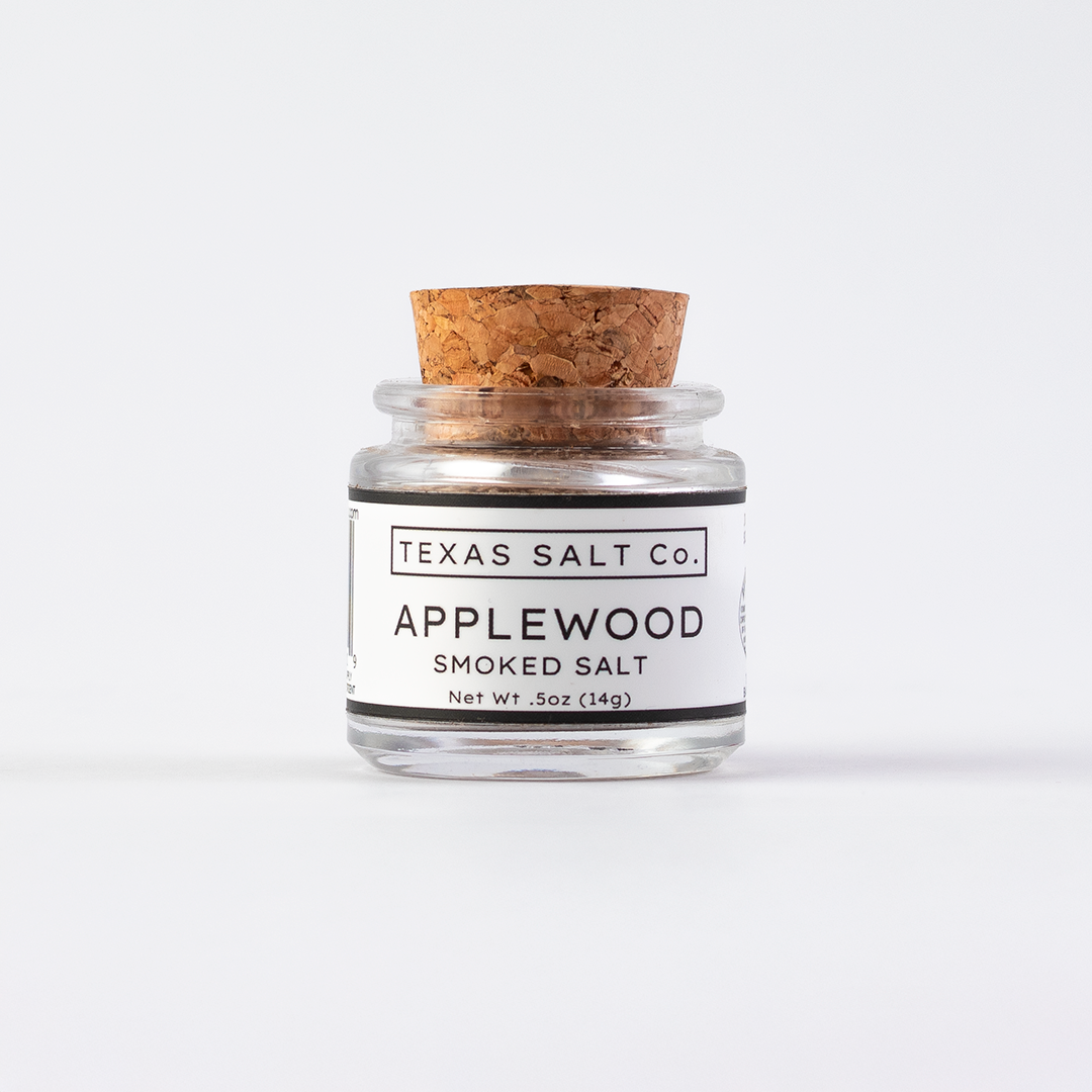 Texas Salt Co. Applewood Smoked Salt .5oz cork-top glass jar shown straight on against a clean white background.