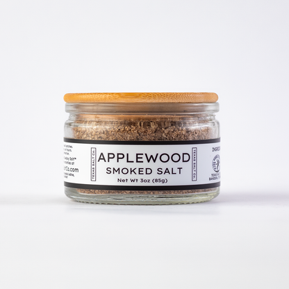 Texas Salt Co. Applewood Smoked Salt 3oz bamboo-lid jar with visible smoked salt texture inside, photographed on a white background.