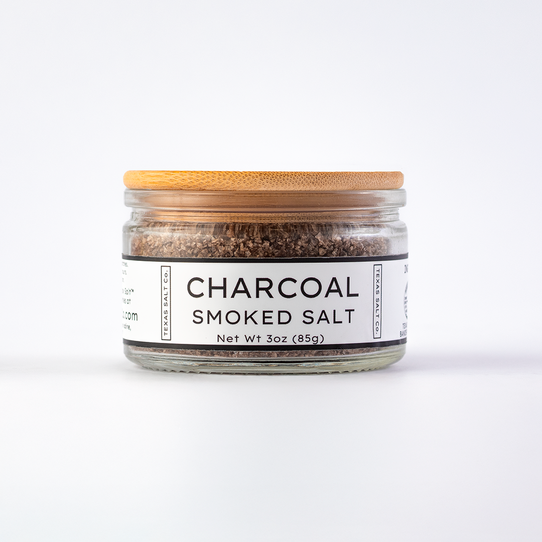 Texas Salt Co. Charcoal Smoked Salt 3oz bamboo-lid jar with visible smoked salt texture inside, photographed on a white background.