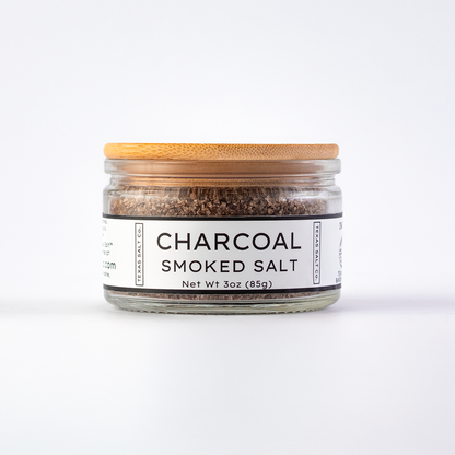 Texas Salt Co. Charcoal Smoked Salt 3oz bamboo-lid jar with visible smoked salt texture inside, photographed on a white background.