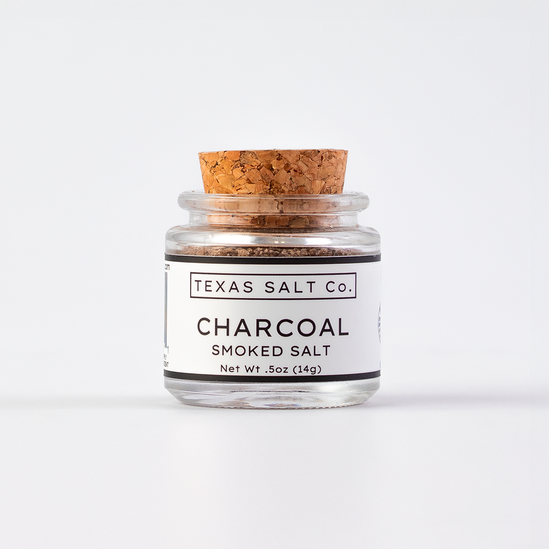 Texas Salt Co. Charcoal Smoked Salt .5oz cork-top glass jar shown straight on against a clean white background.