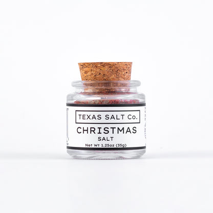 Jar of Texas Salt Co. Christmas salt with a cork lid on a white background