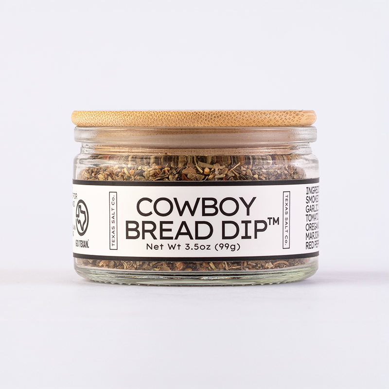 Texas Salt Co. Cowboy Bread Dip™ seasoning in a 3.5oz glass jar with bamboo lid.