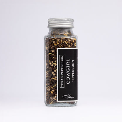 Texas Pepper Co. Cowgirl Peppercorn blend in a 5 oz (142g) glass jar with silver lid and black label.