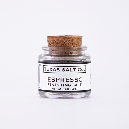 Mini glass jar of Texas Salt Co. Espresso Finishing Salt, 0.75 oz (21g), with cork lid and white label, filled with coffee-infused salt.