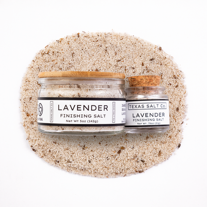 Two jars of lavender finishing salt from Texas Salt Co on a white background