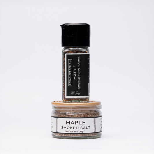 Stacked duo of Texas Salt Co. jars: grinder-top Maple Smoked Peppercorn and wide bamboo-lid Maple Smoked Salt